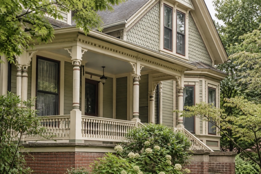Generic nineteenth-century porch and gable details in a leafy setting
